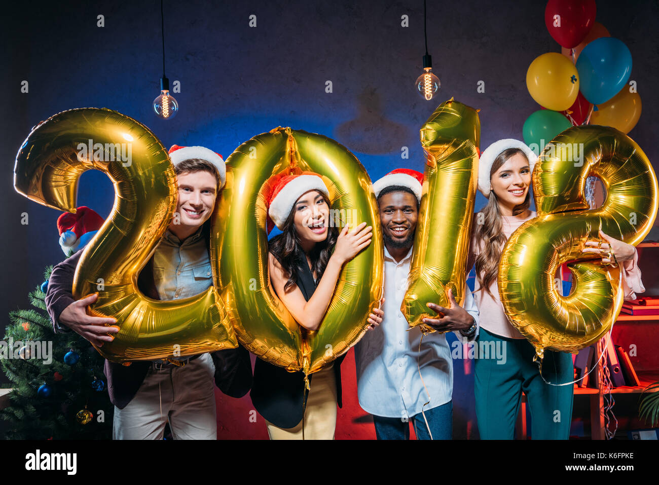 young friends with golden balloons Stock Photo - Alamy