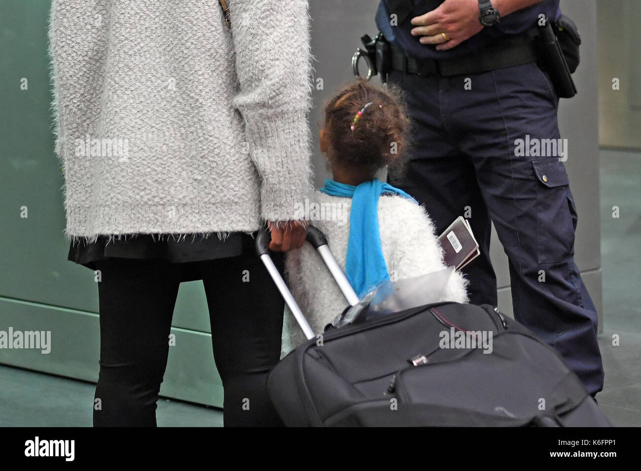 Embargoed to 1800 Tuesday September 12 A young child travels through Border Control after arriving on a Eurostar train from Paris as officers from the Metropolitan Police Service, British Transport Police, Kent Police and UK Border Force take part in Operation Limelight at the Eurostar terminal at St Pancras International in London, which is aimed at safeguarding children and vulnerable people from harmful practices and human trafficking. Stock Photo