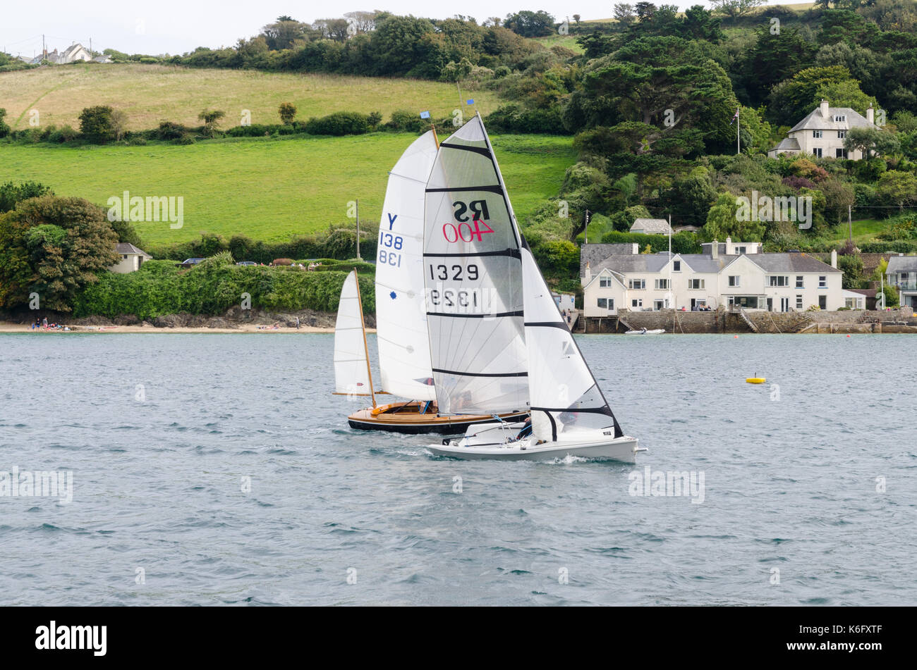 Sailing dinghies racing in the estuary Stock Photo Alamy