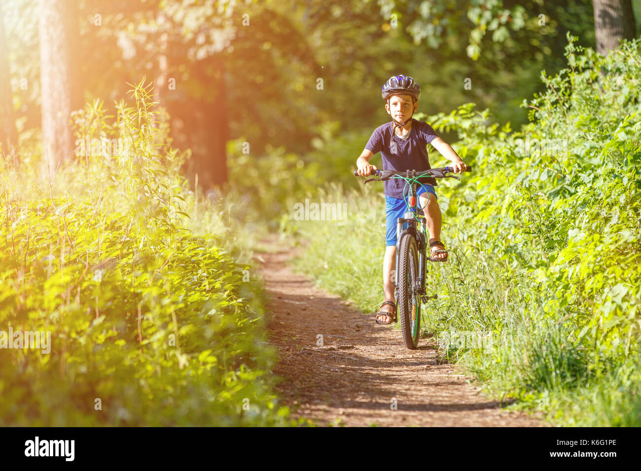 Boy riding bike hi-res stock photography and images - Alamy