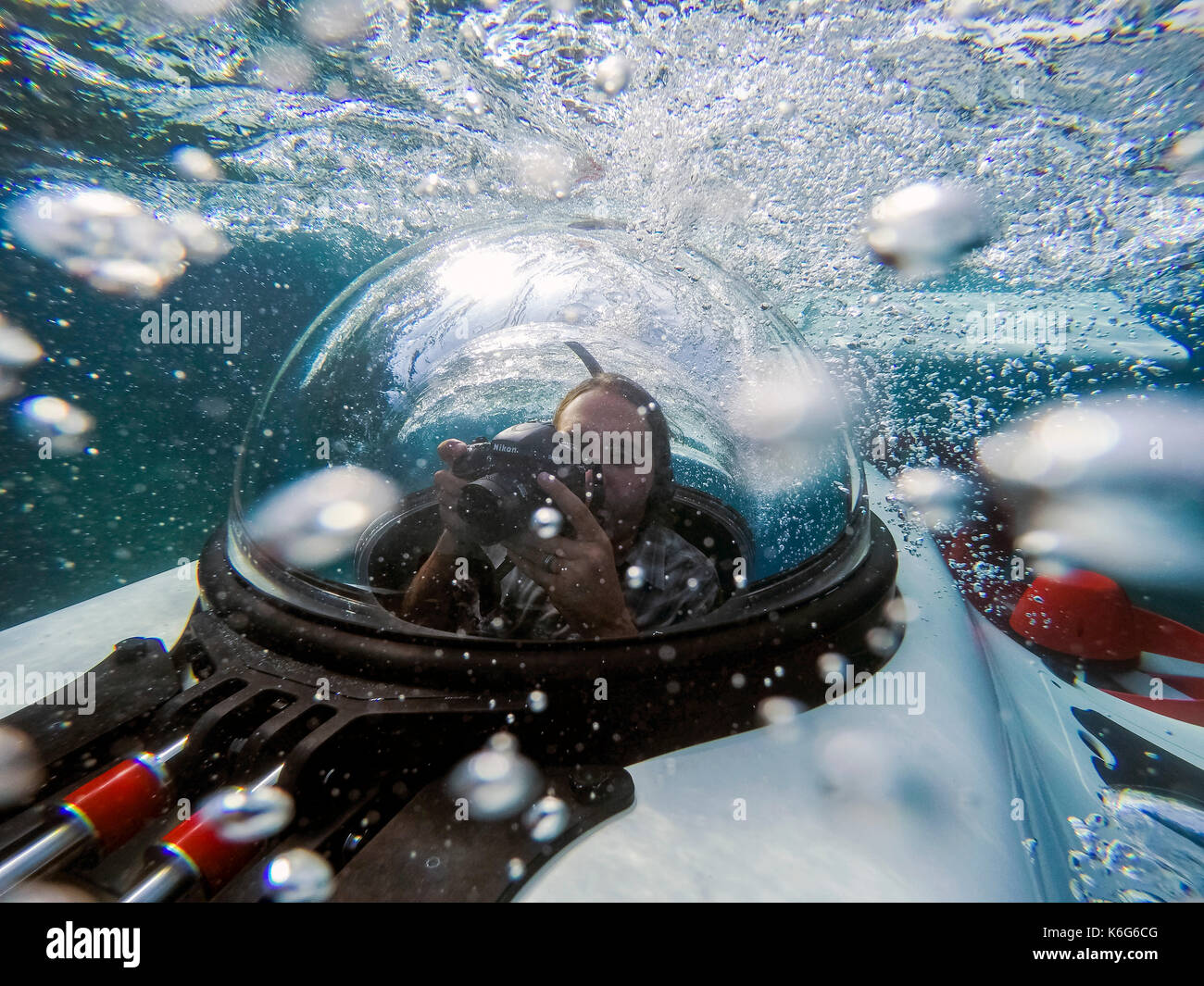 Photographer inside personal two-man submarine underwater, Lake Tahoe, California, USA Stock Photo