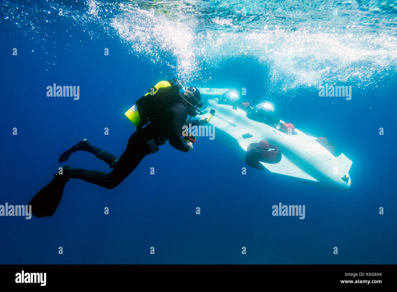 Scuba diver swimming near prototype personal submarine, Lake Tahoe, California, USA Stock Photo