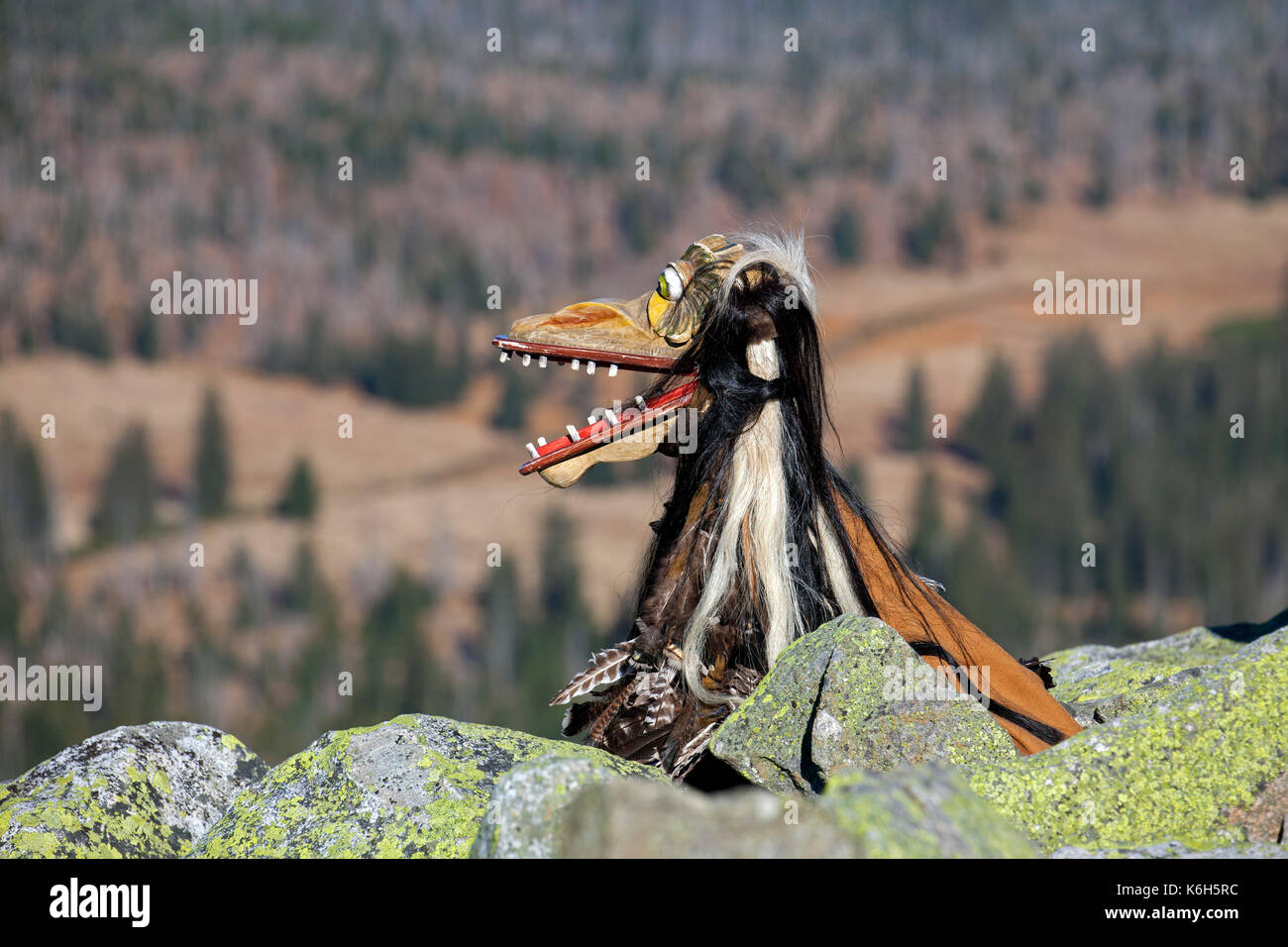 Scary wooden devil figure on the summit of Mount Lusen in autumn, Bavarian Forest National Park, Bavaria, Germany Stock Photo