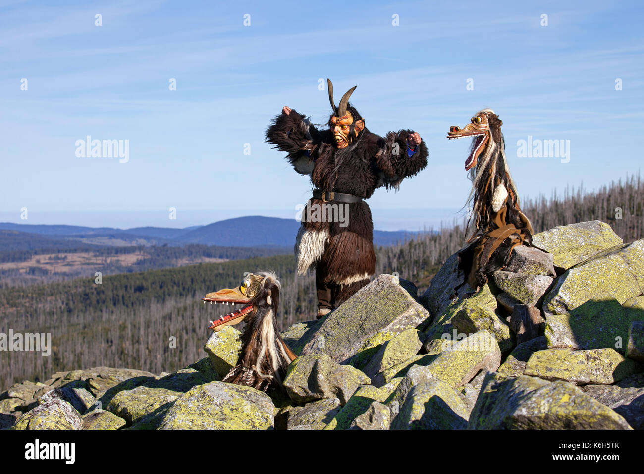 Scary wooden devil sculptures on the summit of Mount Lusen in autumn, Bavarian Forest National Park, Bavaria, Germany Stock Photo