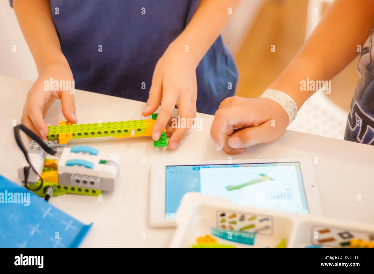 Kids building robots in classroom Stock Photo