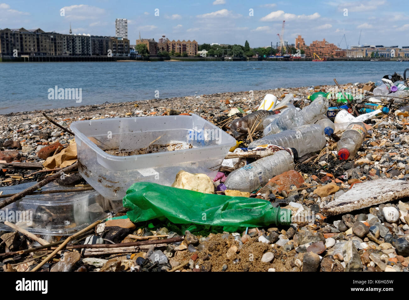 Plastic debris on the bank of the River Thames, London England United Kingdom UK Stock Photo