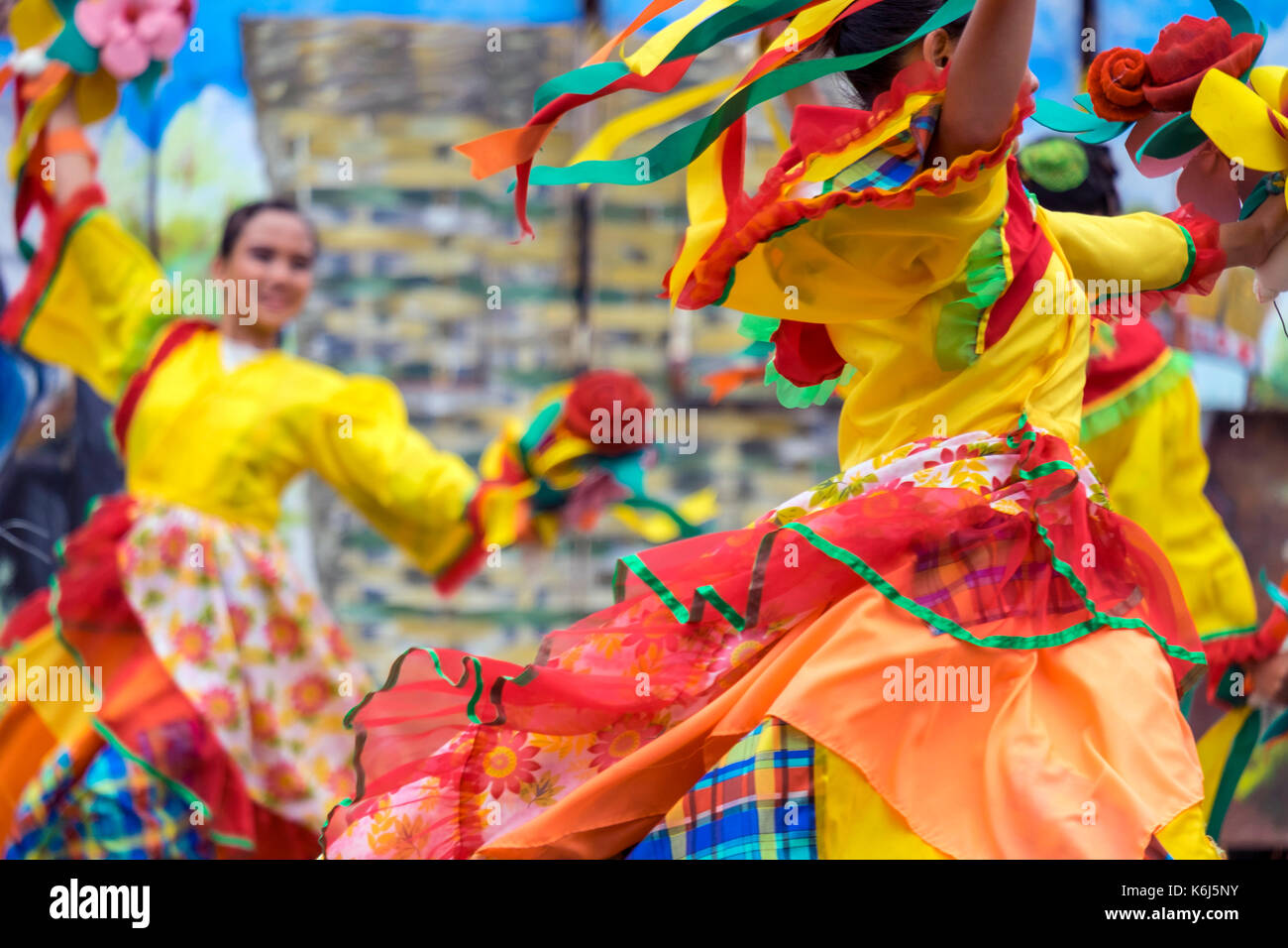 Women in colorful costumes performing at Dinagyang Festival, Iloilo, Philippines Stock Photo