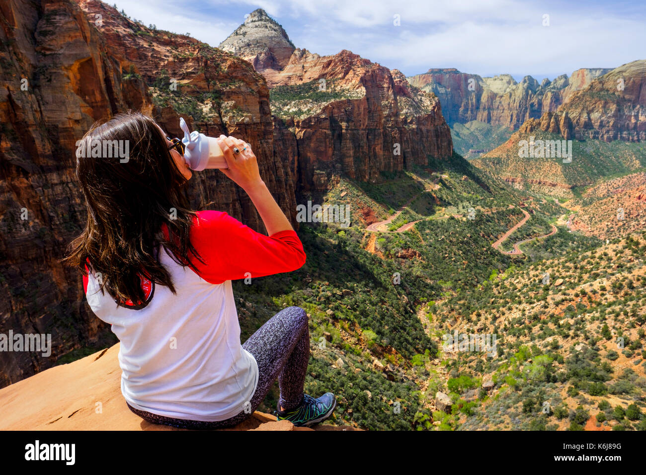 Female hiker drinking in Zion National Park, Utah, USA Stock Photo