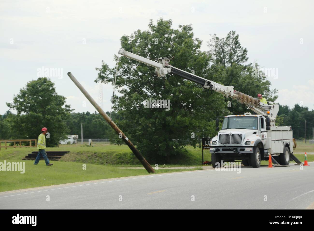 Contractors complete work to replace utility power poles Stock Photo ...