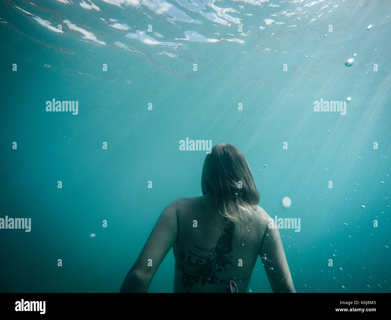 Woman swimming underwater, St. John, US Virgin Islands, USA Stock Photo