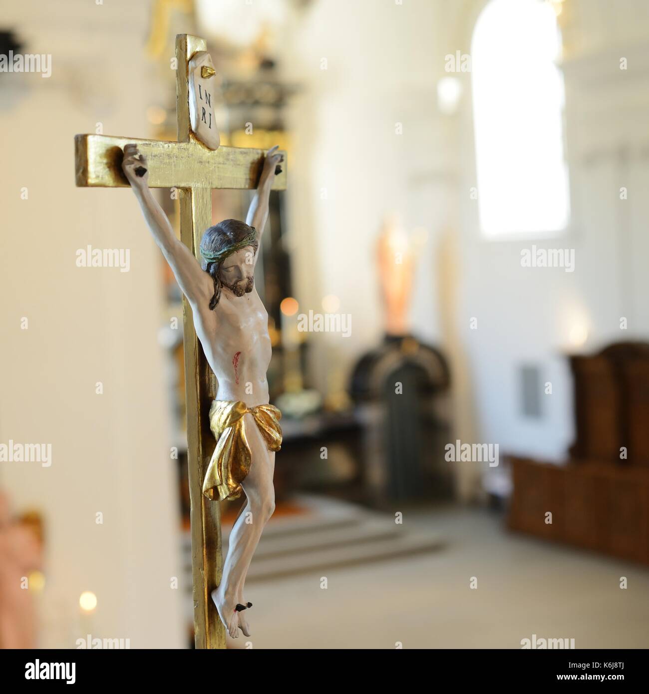 Jesus Christ on cross in church Stock Photo