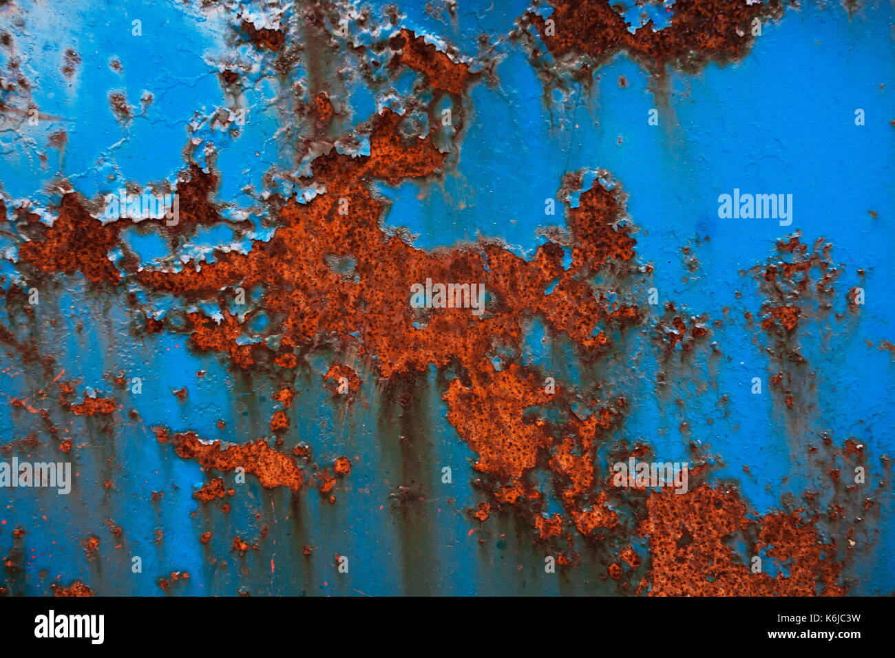 Abstract of blue metal that has been weathered with rust Stock Photo