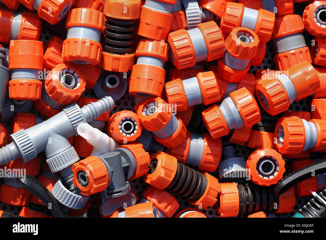 Large pile of plastic garden hose fittings Stock Photo Alamy