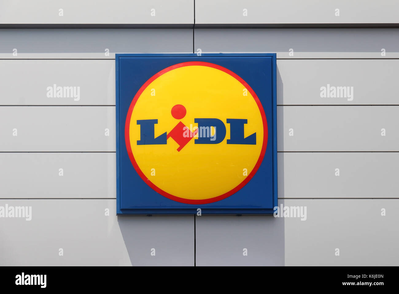 VIENNA, AUSTRIA - JULY 10, 2015: Large Lidl logo sign on facade of supermarket. Lidl is a German global discount supermarket chain that operates in ov Stock Photo