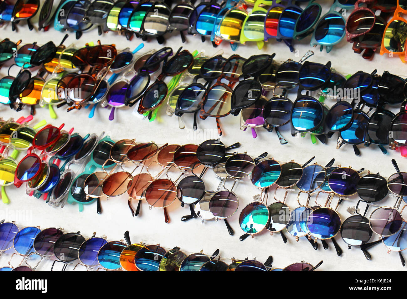 Colorful sunglasses variety sold on market stall Stock Photo Alamy