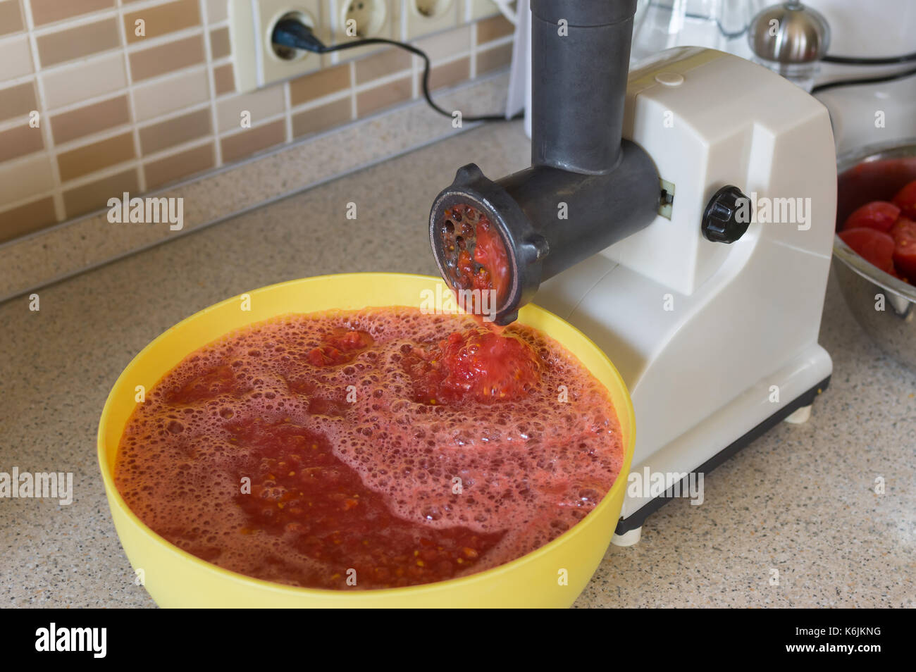 Electric mincing machine used for tomato juice production in Ukrainian families Stock Photo Alamy