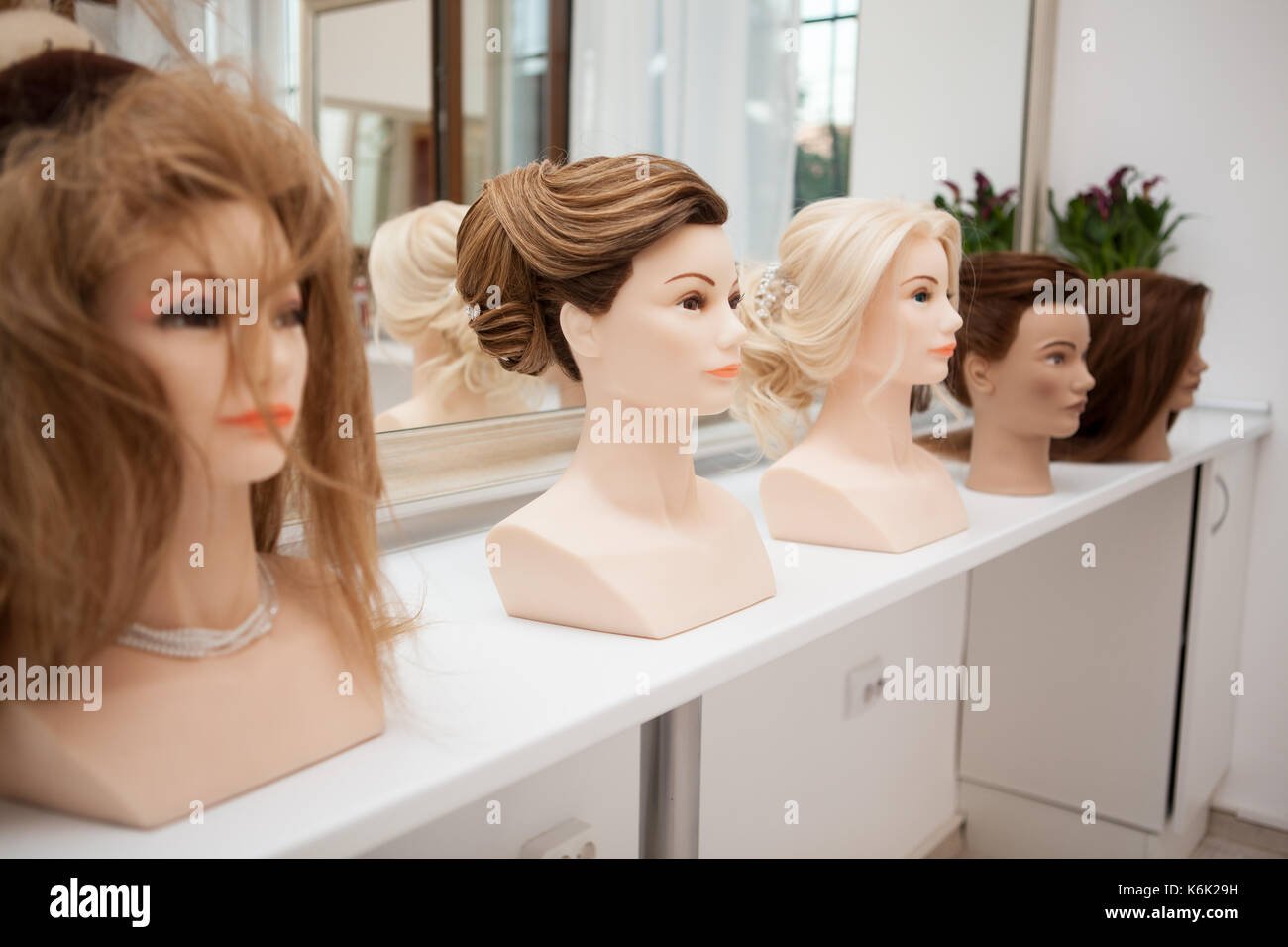 Different mannequin with different hairstyles Stock Photo Alamy