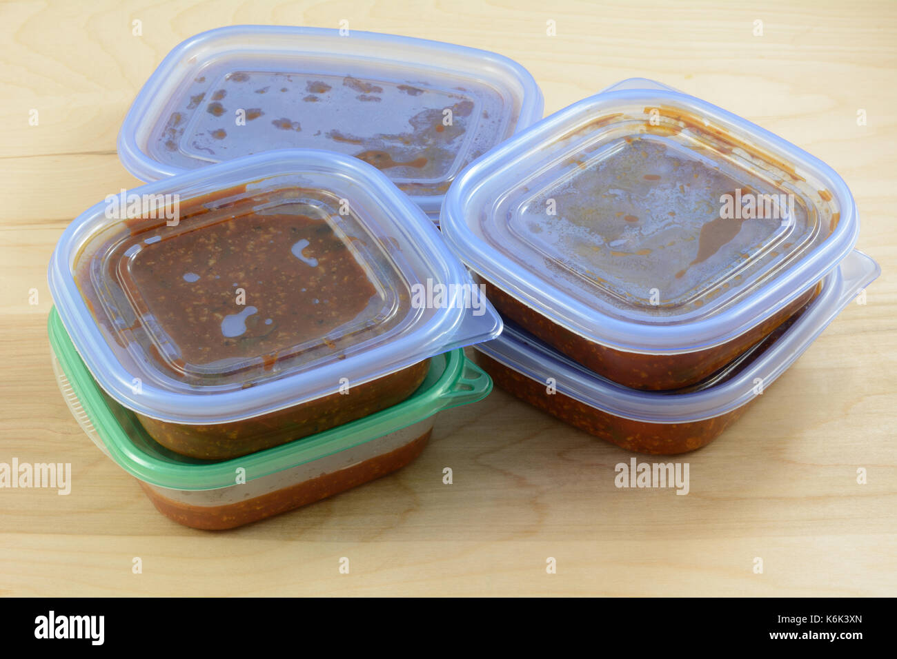 Batch of cooked turkey spaghetti sauce pit in storage containers for freezing for quick future