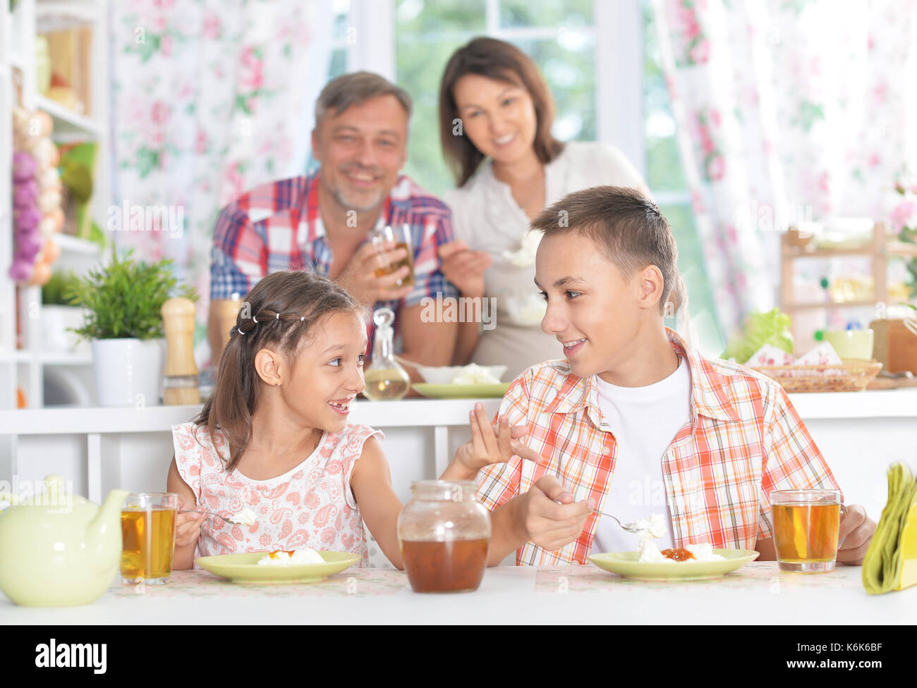 Brother and sister having breakfast Stock Photo Alamy