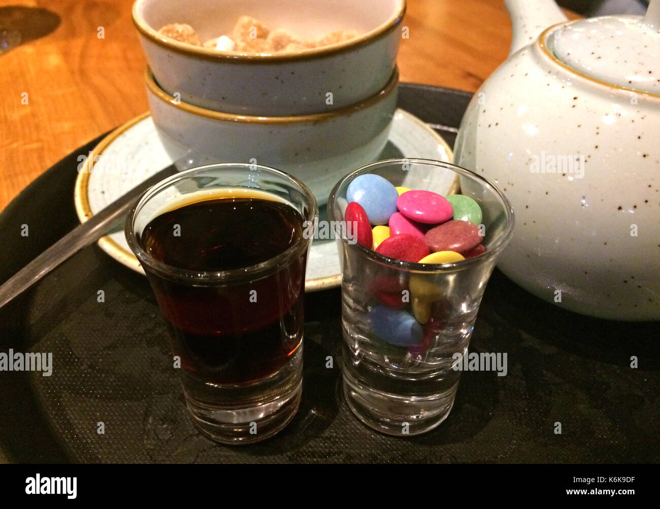 Shot of Jagermeister (German spirit) served with candy Stock Photo