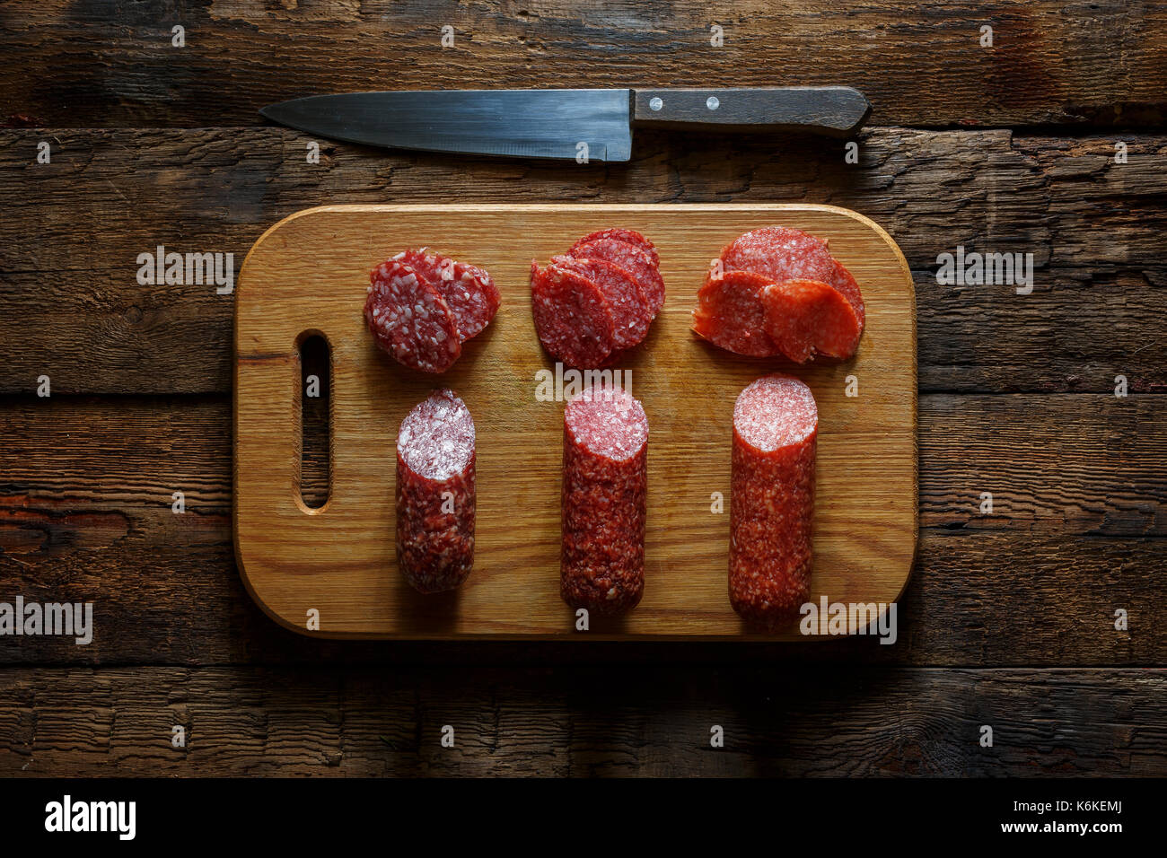 Wooden cutting board with salami wine, Italian authentic traditional