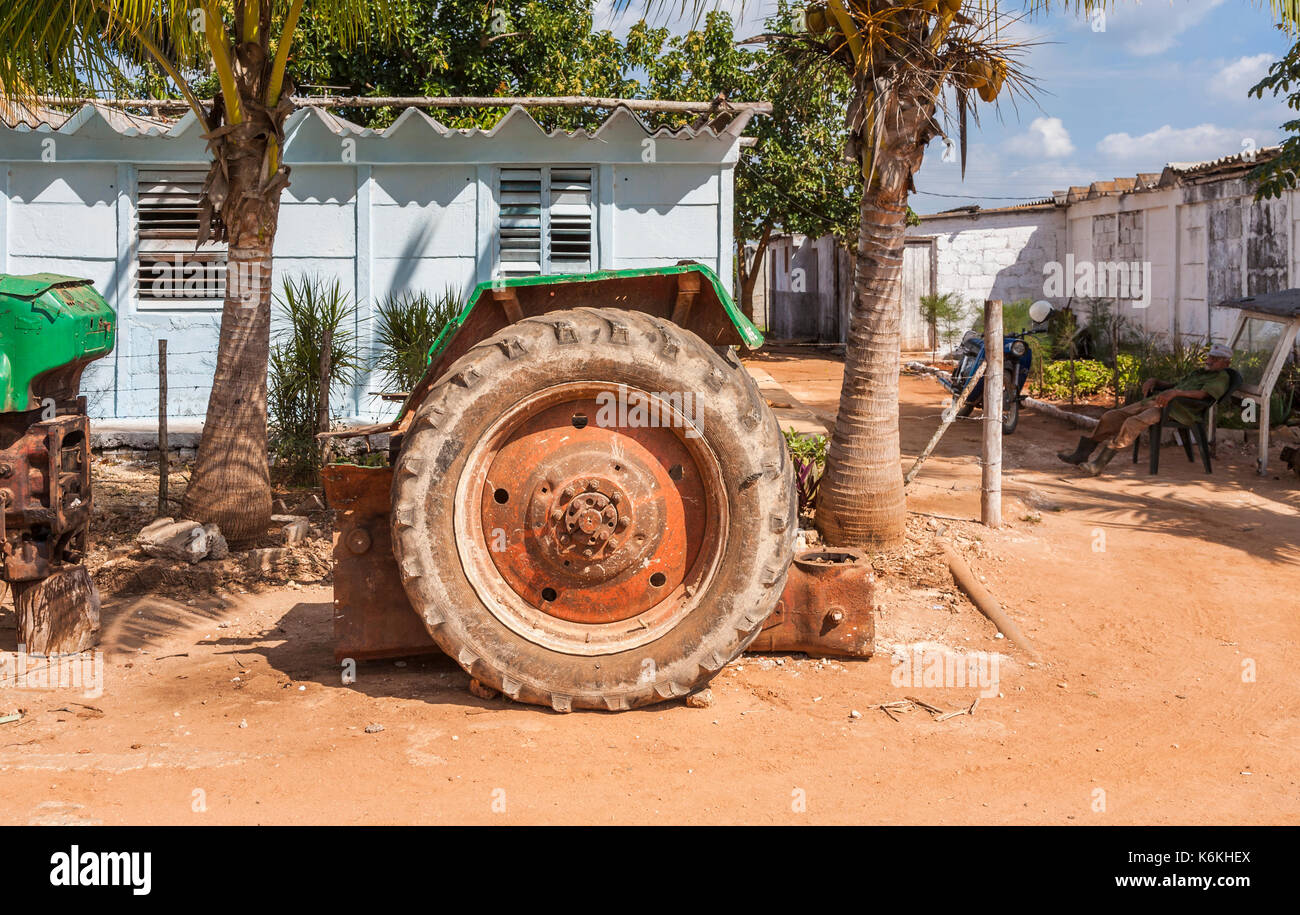 Broken tractor on a dilapidated smallholding farm near Cienfuegos, a city on the south coast of Cuba Stock Photo
