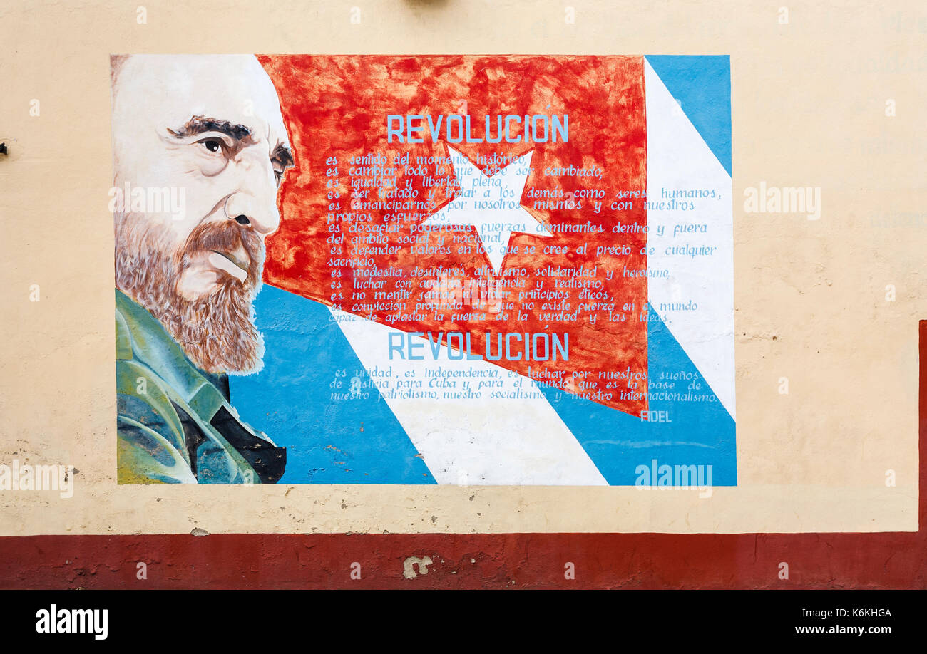Roadside wall painting of Fidel Castro and the Cuban flag, Cienfuegos, a city on the south coast of Cuba Stock Photo