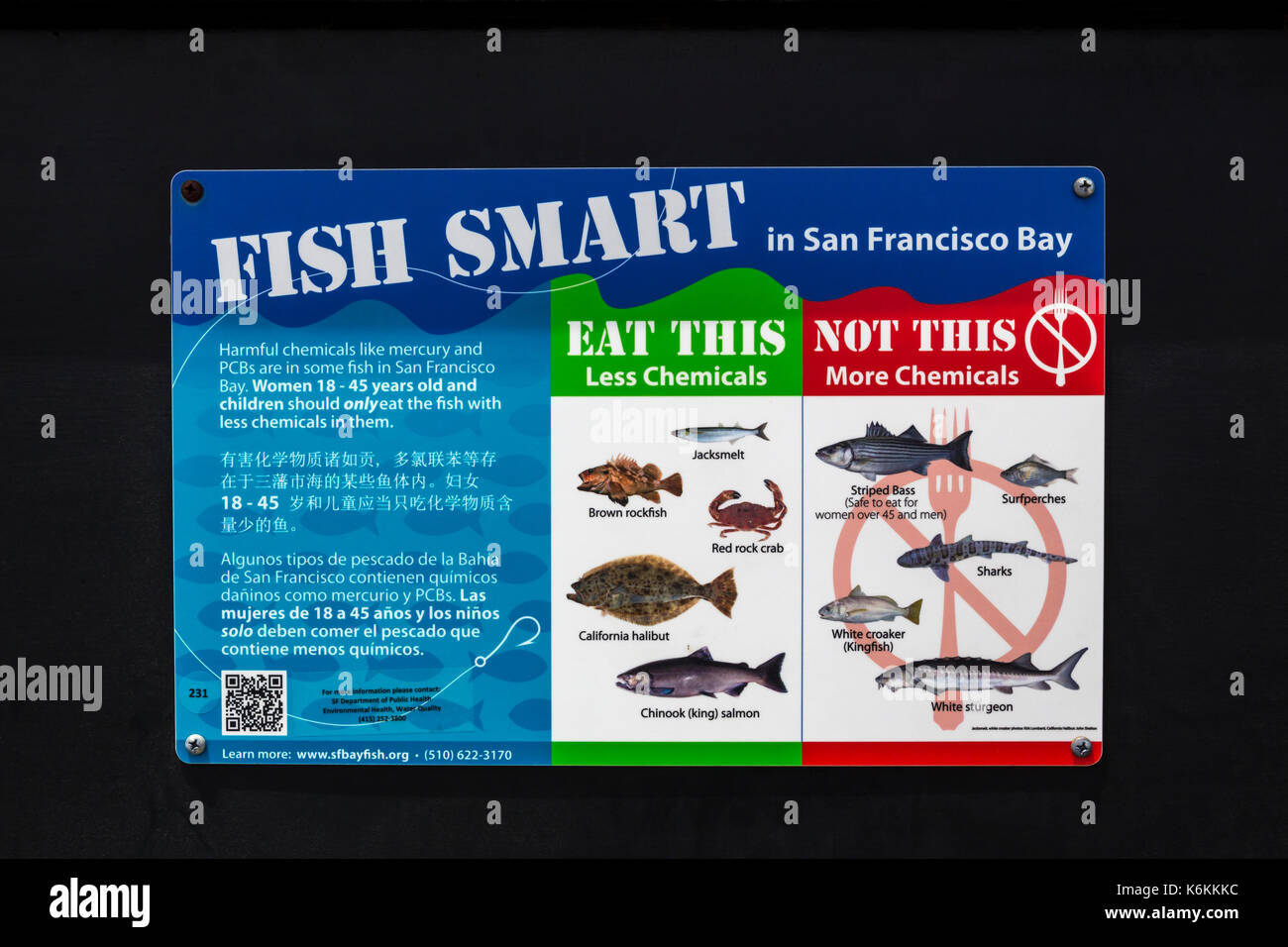 English and Chinese and Spanish language sign, trilingual sign, fish smart, Fort Baker fishing pier, Fort Baker, Sausalito, Marin County, California Stock Photo