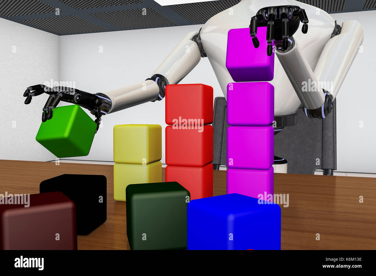 A robot stacks colorful blocks Stock Photo - Alamy