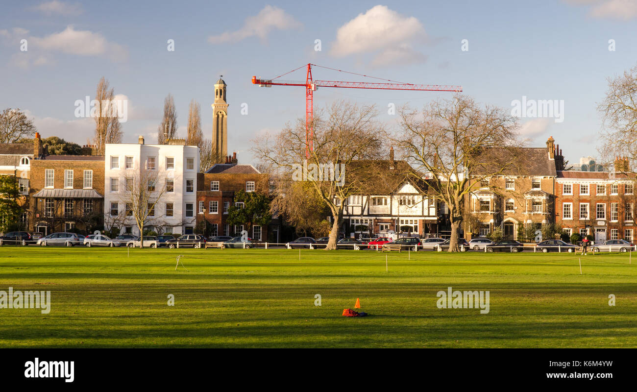 Sun shines on houses along Kew Green in south west London Stock Photo Alamy