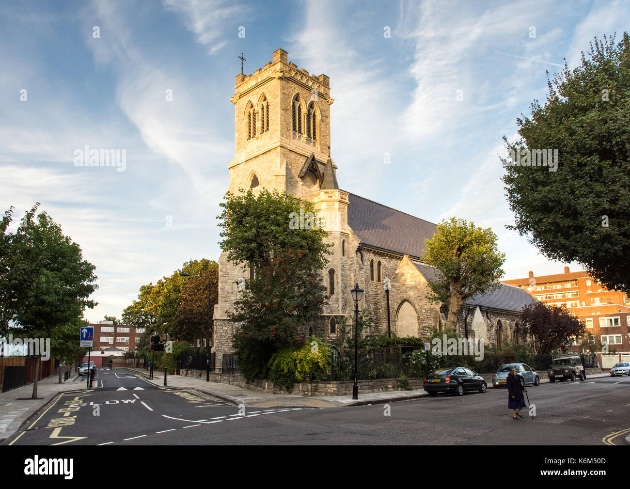 London, England, UK - September 29, 2016: Evening sun illuminates the tower and west face of Holy Trinity With St Barnabas Church on Hartland Road in  Stock Photo