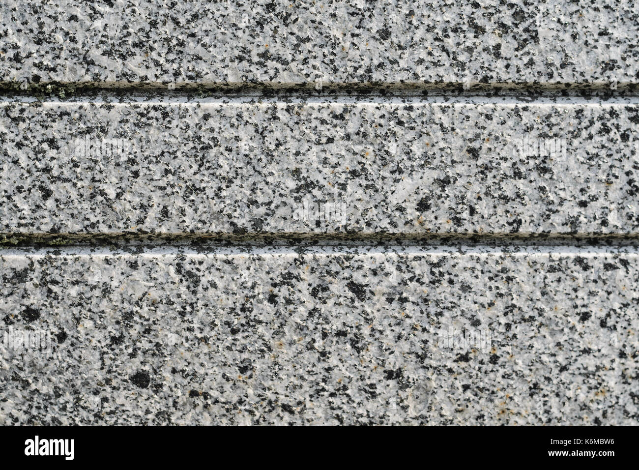 Gray Granite Texture with Parallel Decorative Grooves. Natural Stone as