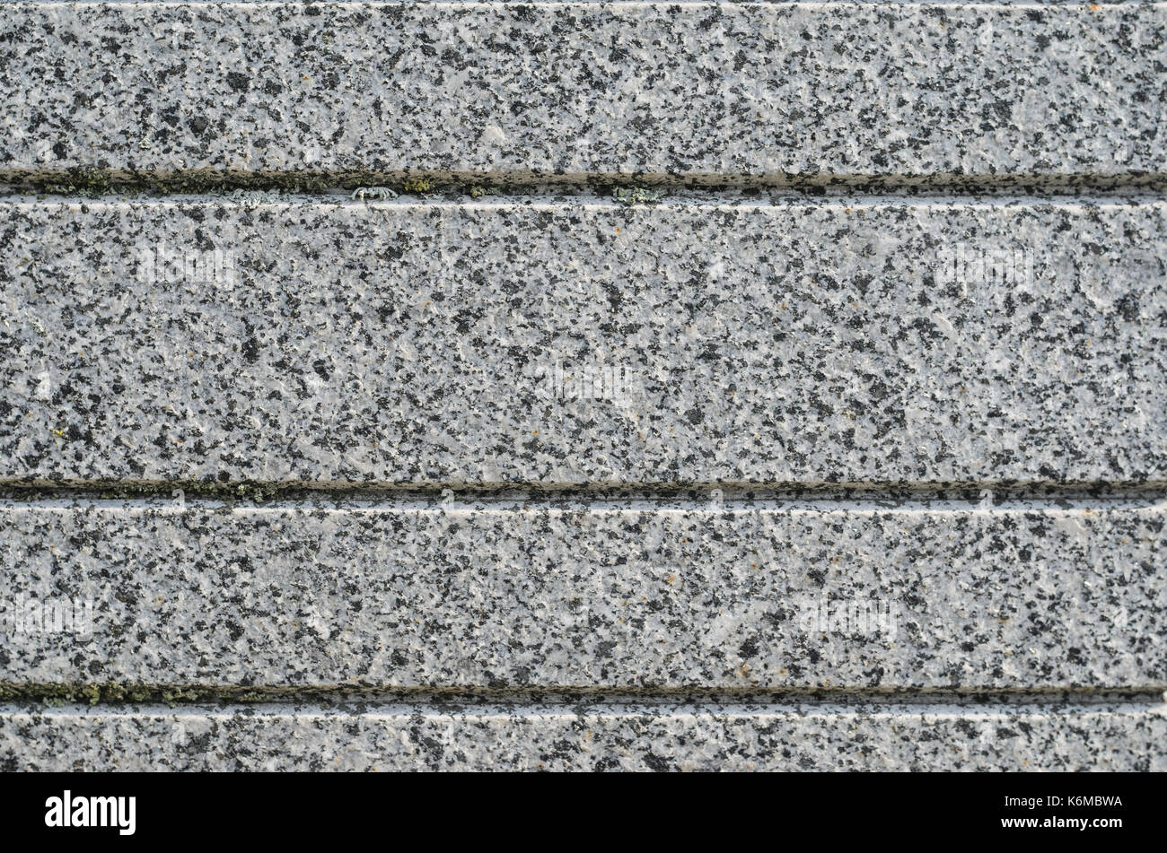 Gray Granite Texture with Parallel Decorative Grooves. Natural Stone as