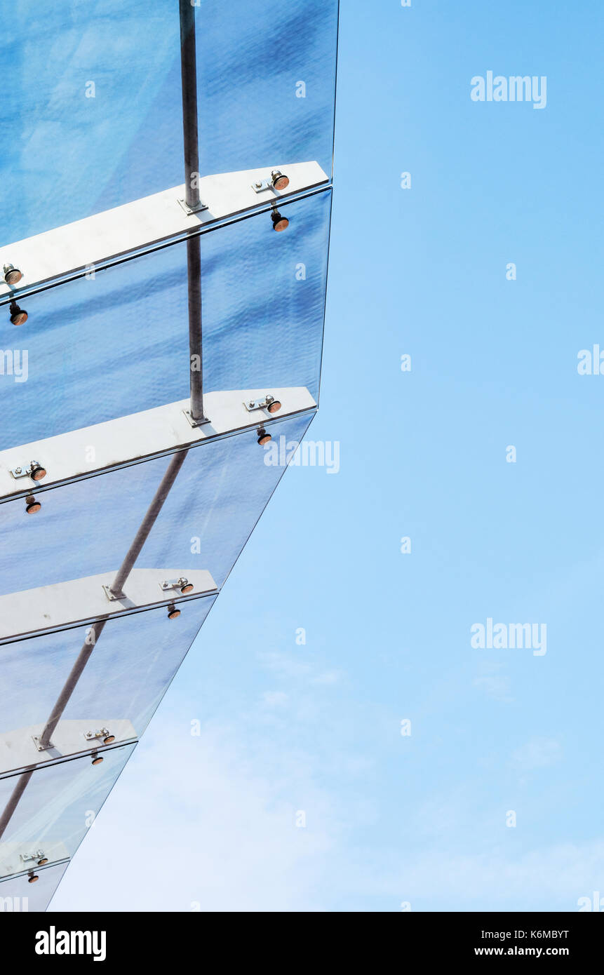 Glass Canopy Against Blue Sky Background. Fastening Elements of Glass
