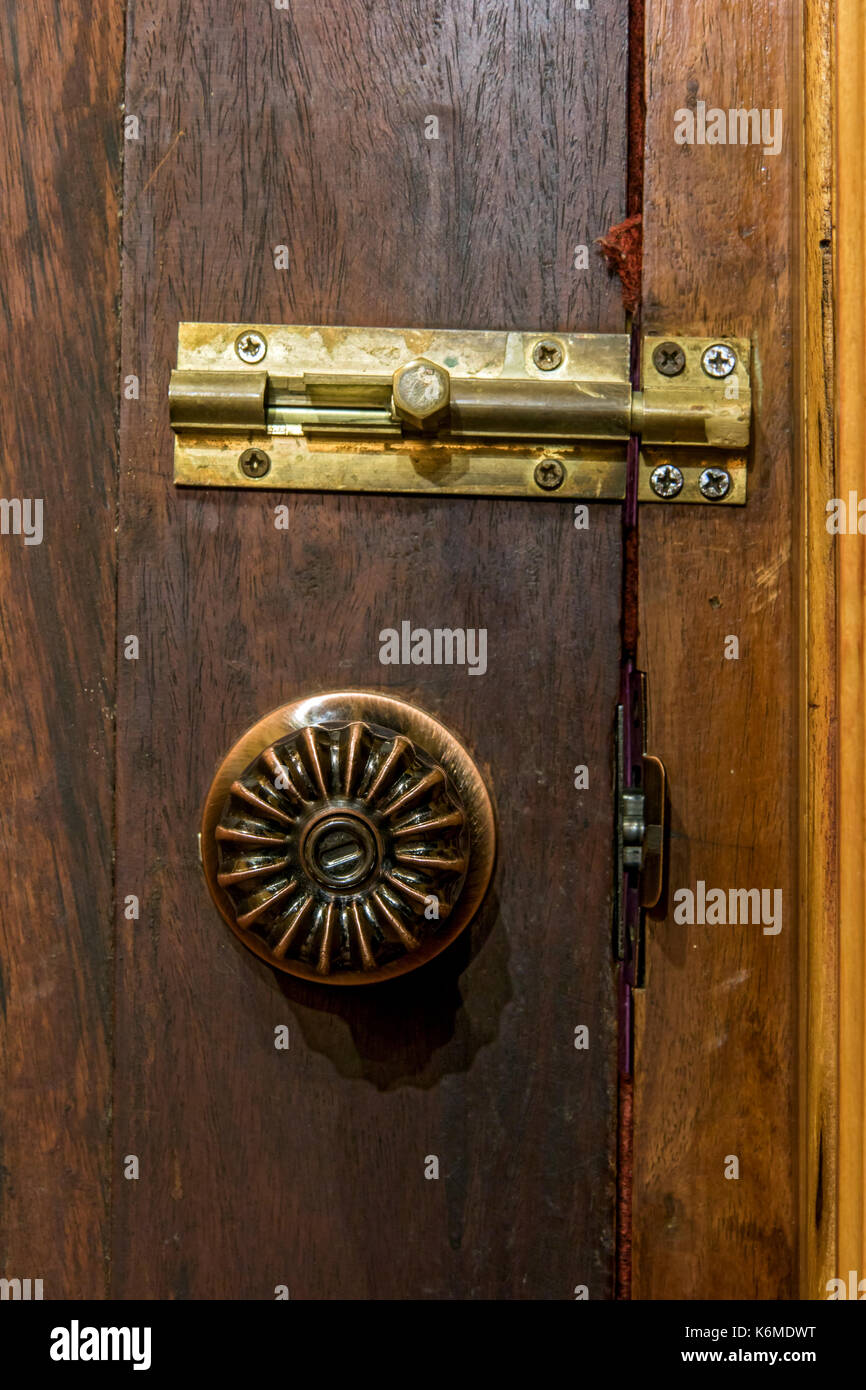 Close Up Old Decorative Door Knob With Latch On Wood Door