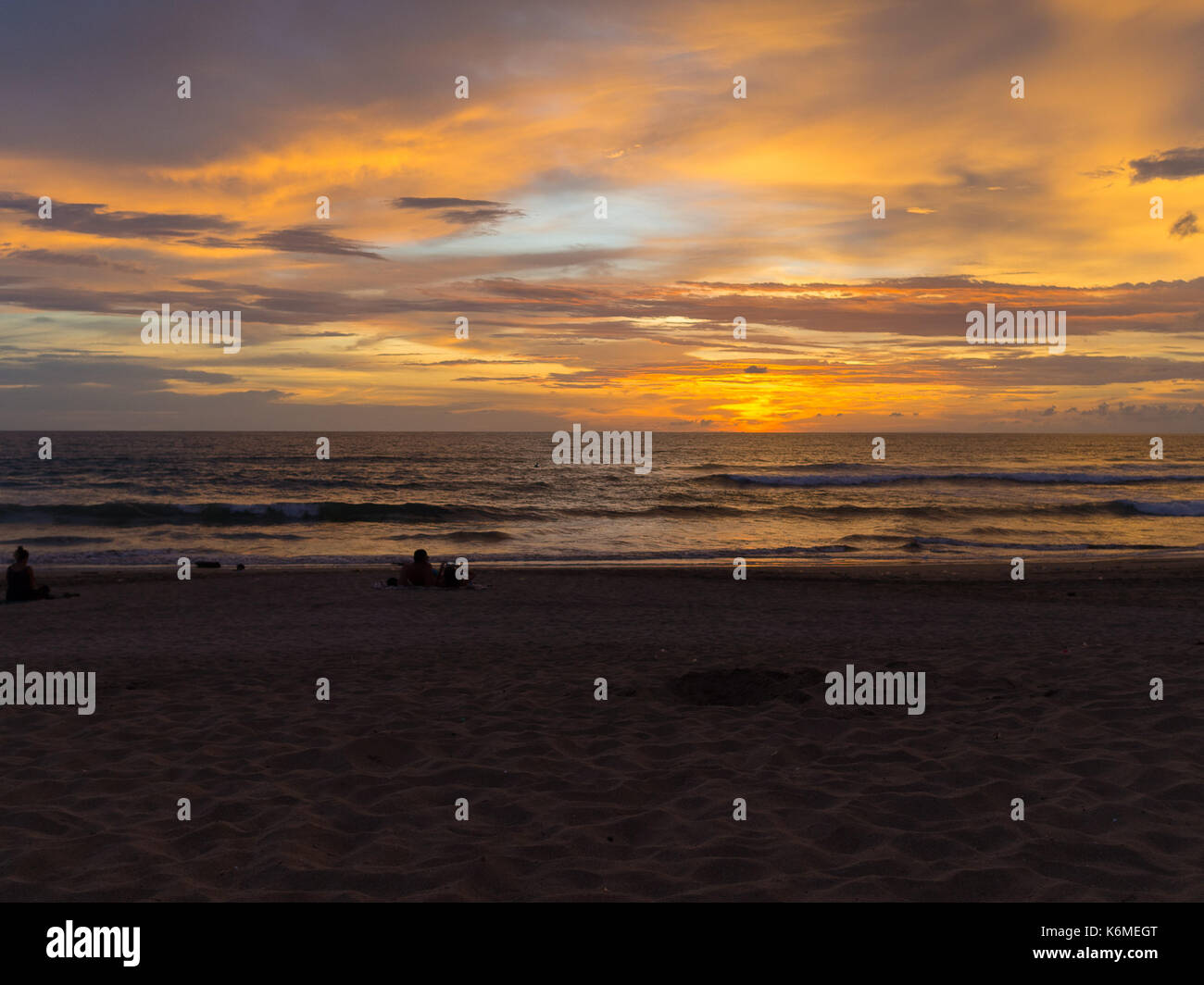 Sunset with clouds of different shapes. People make photos. Bali, Indonesia, Indian ocean Stock Photo