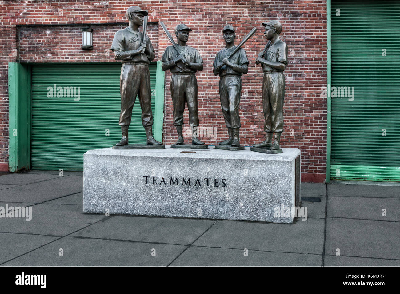 Boston Red Sox Teammates -  Bronze statue of 'The Teammates'  Red Sox players and decades-long friendship of four legends Ted Williams, Johnny Pesky, Bobby Doerr and Dom DiMaggio.   The statue of the four teammates stands outside of Gate B at Fenway Park at the intersection of Ipswich and Van Ness streets.  Available in color as well as in a black and white print.  To view additional images from my Fenway Park gallery please visit: www.susancandelario.com Stock Photo