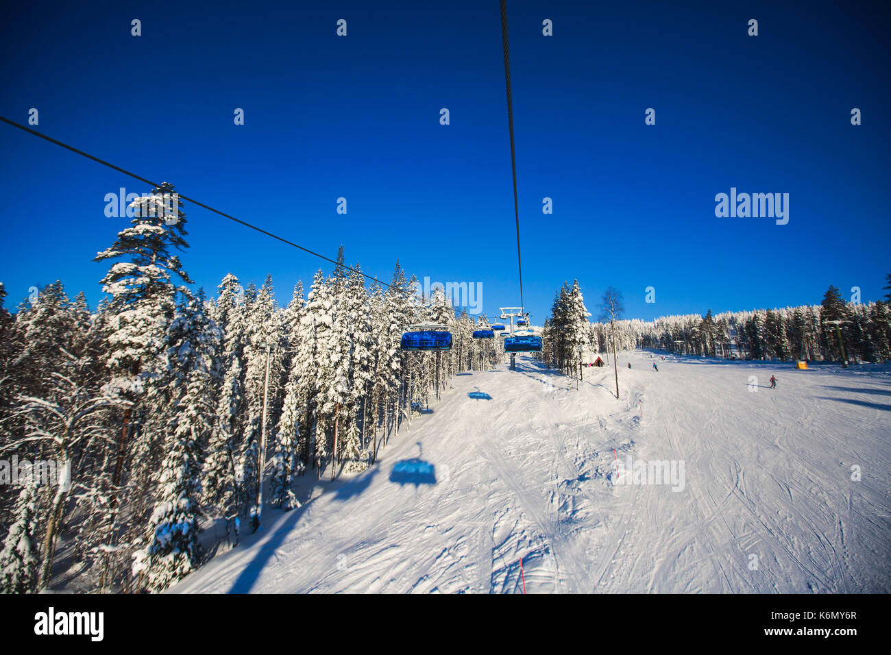 Beautiful cold mountain view of ski resort, sunny winter day with slope ...