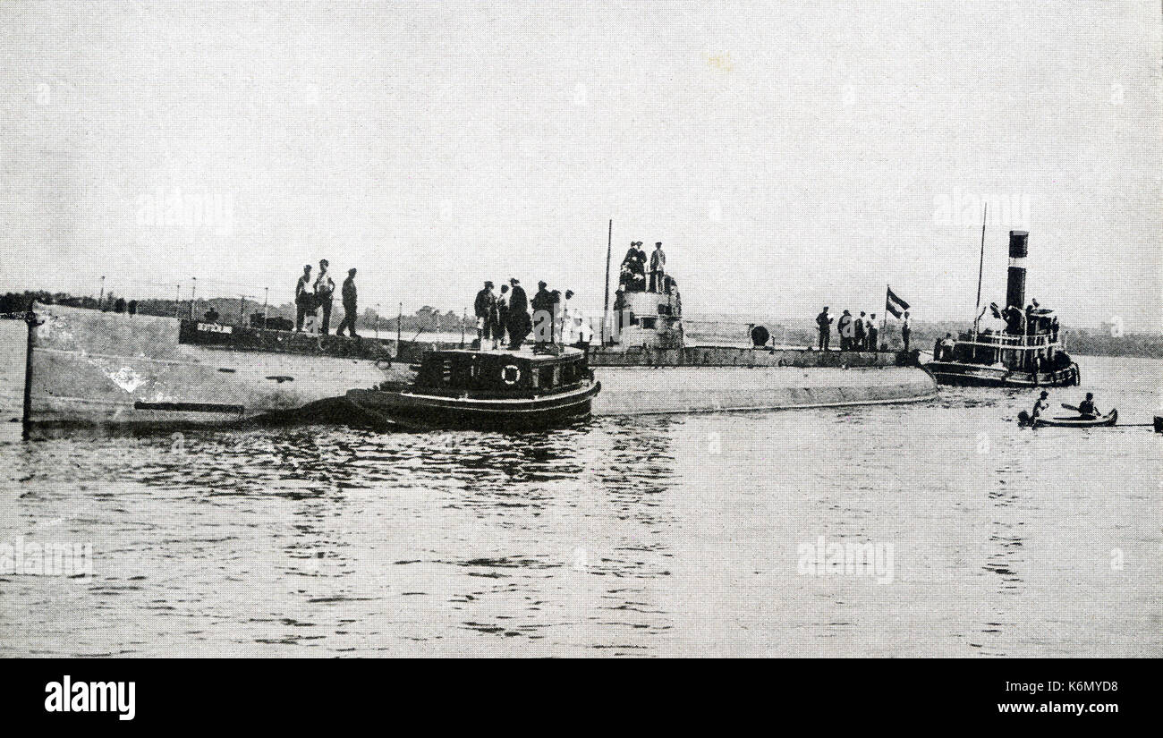 This photo taken during World War I shows German merchant submarine Deustchland lying in Chesapeake Bay before returning across the Atlantic. In spite of the vigilance of English patrols, the Deutschland  made two trips to the United States, landing once at Baltimore and once at New London. The Deutschland was a blockade-breaking German cargo submarine. It was private and owned by the North German Lloyd Line and had a capacity of 700 tons. Its commanding officer was Paul Koenig. It was used for high-value trans-Atlantic commerce, submerging to avoid British patrols. Stock Photo