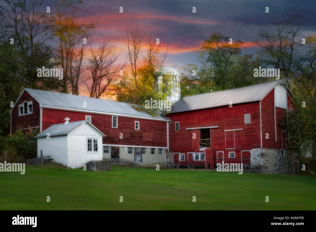 Last Light At The Red Barn - Red barn and silo at a farmhouse in Sussex County, New Jersey. Stock Photo
