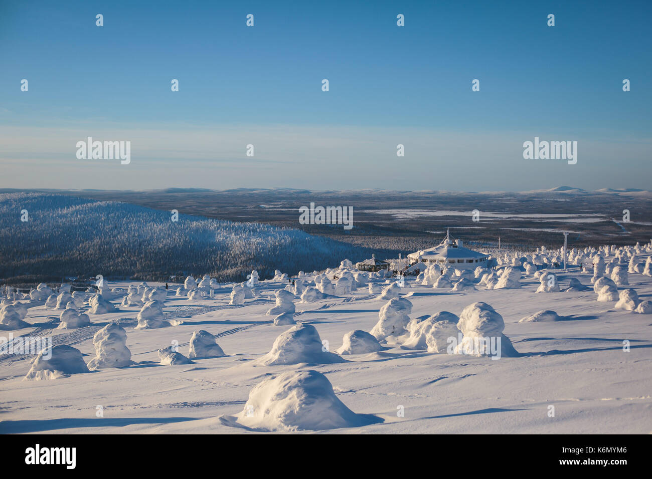 Beautiful cold mountain view of ski resort, sunny winter day with slope, piste and ski lift Stock Photo