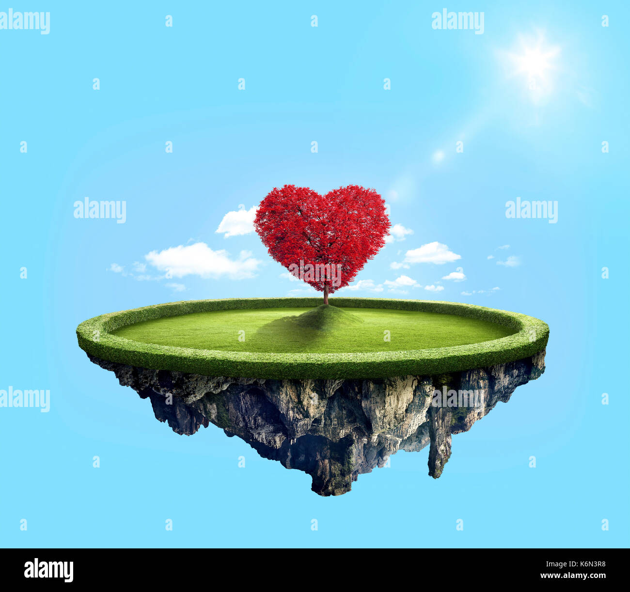 Amazing island with red love heart tree floating in the air under lovely sun ray Stock Photo