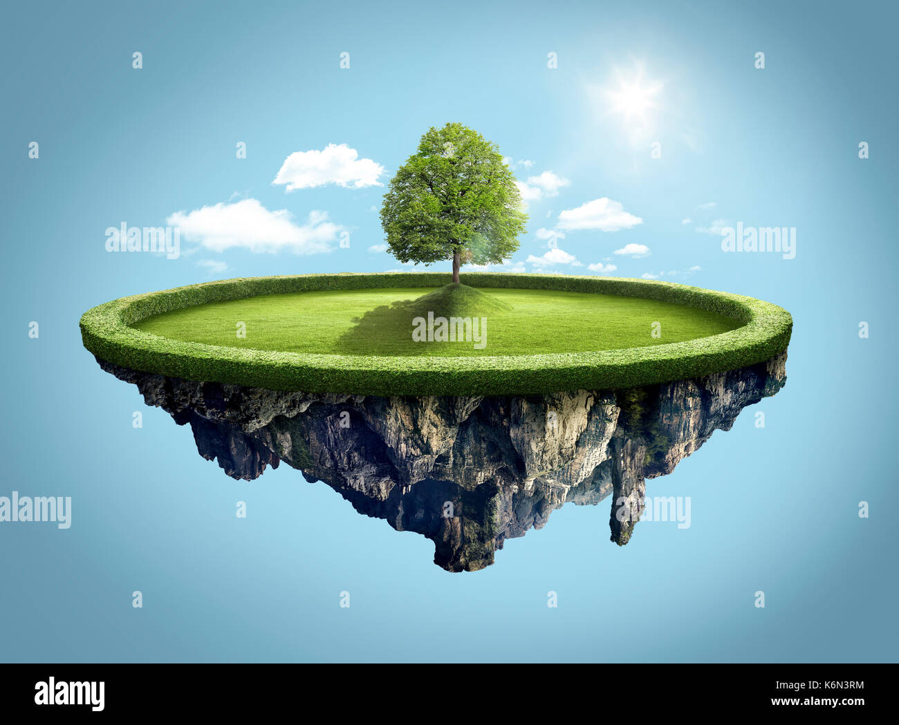 Amazing island with tree floating in the air under clouds and lovely sun ray Stock Photo