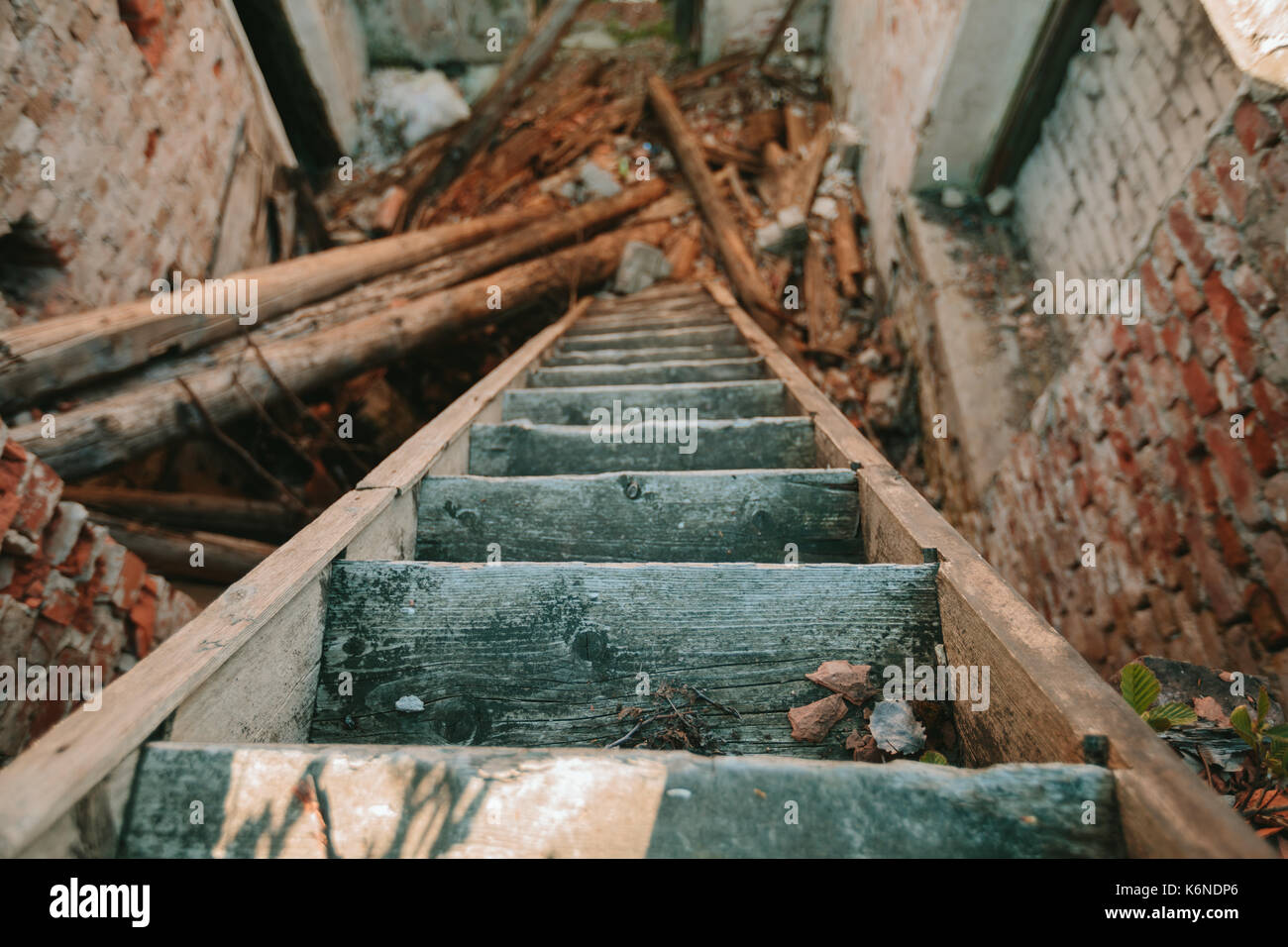 Old wooden staircase descending down Stock Photo