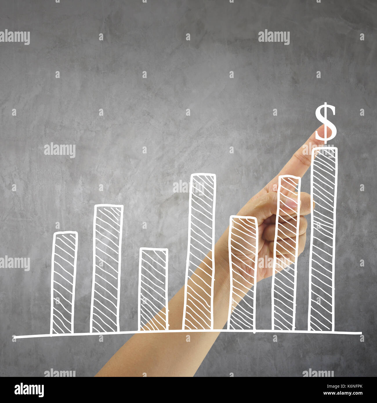 finger of a businessman pointing to the top graph and have alphabet ...