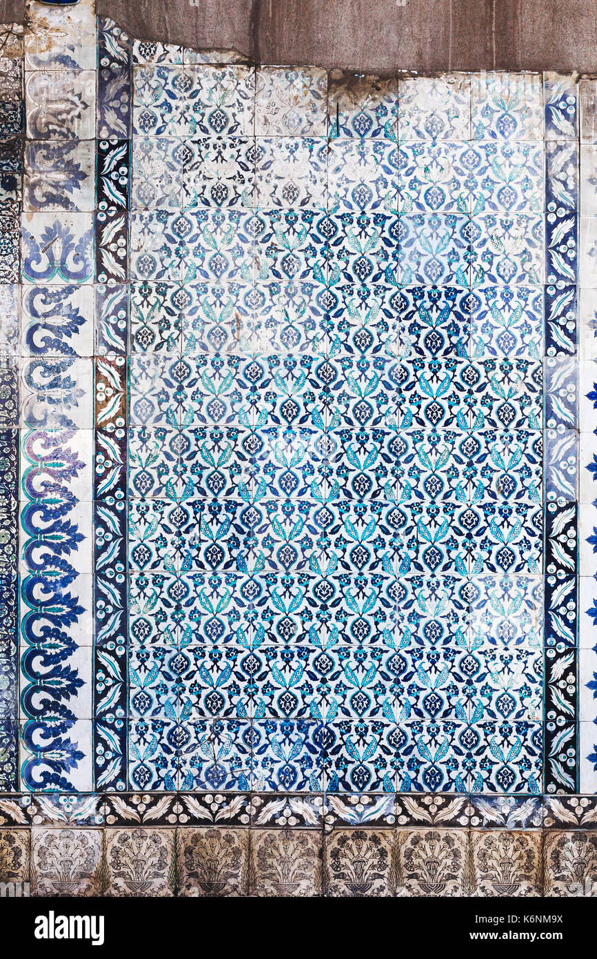 Seamless pattern white Turkish tiles with blue ornaments. Old surface