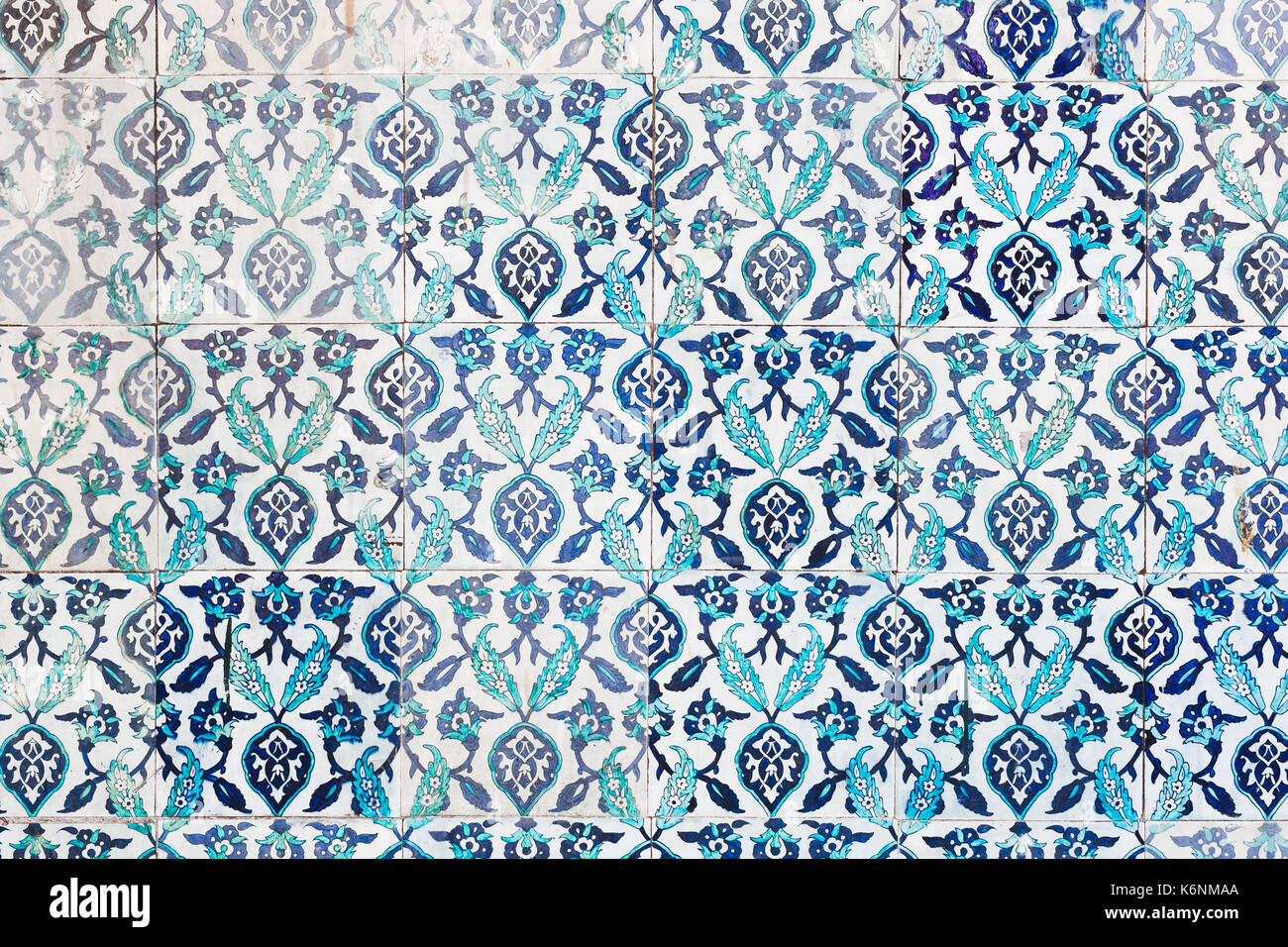 Seamless pattern white Turkish tiles with blue ornaments. Old surface