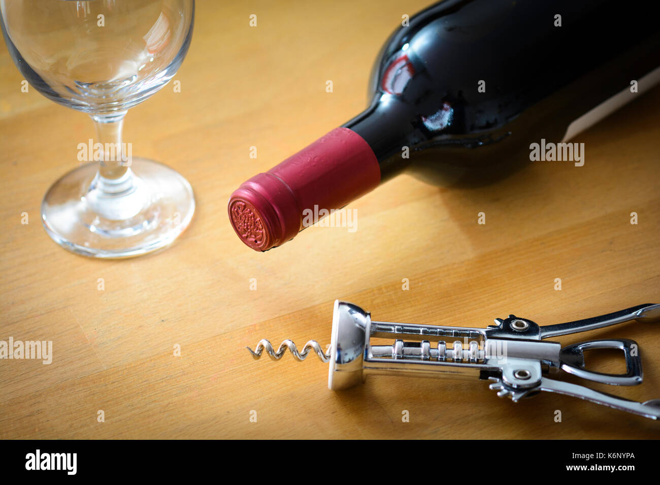 Bottle of red wine with glasse and corkscrew Stock Photo