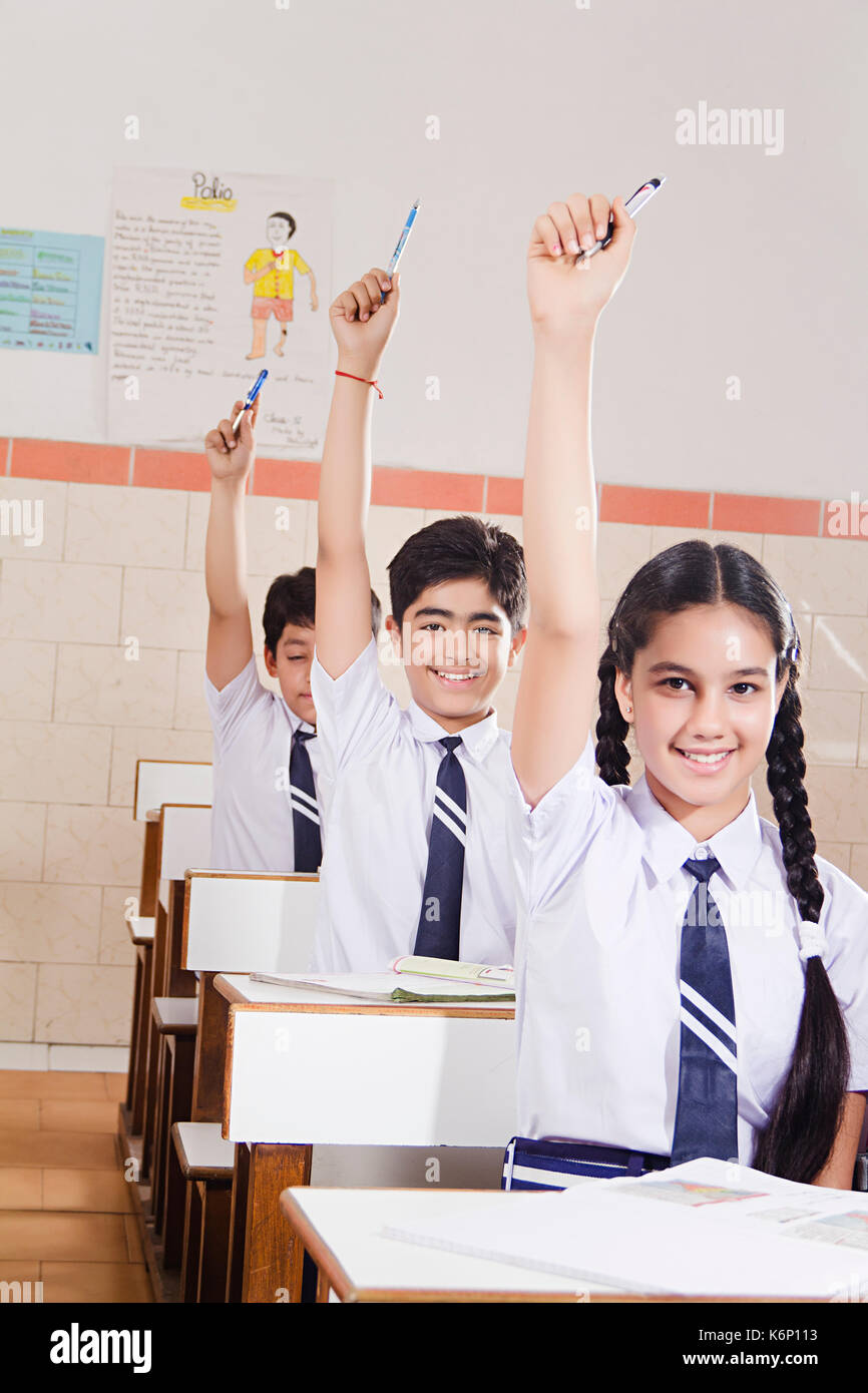 Indian 3 High School Kids Students Study Hand Raised In Classroom Education Learning Stock Photo