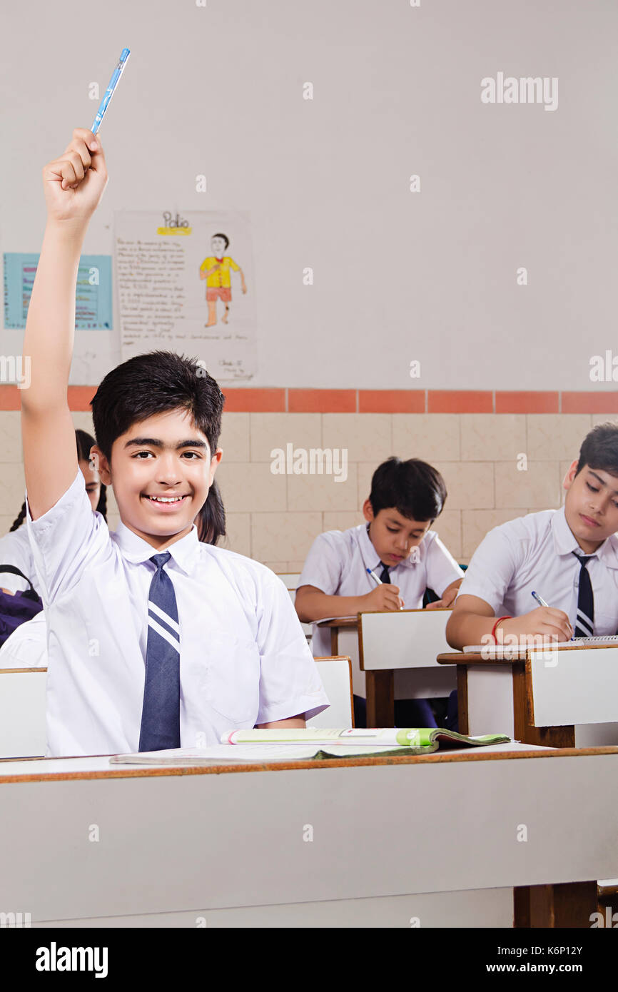 Happy Indian High School Students Studying Hand Raised In Classroom Education Learning Stock Photo